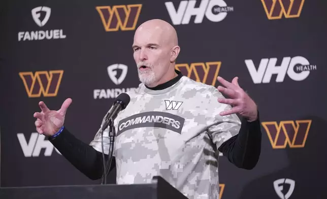 Washington Commanders head coach Dan Quinn speaks during a news conference following an NFL football game against the Philadelphia Eagles Thursday, Nov. 14, 2024, in Philadelphia. (AP Photo/Chris Szagola)