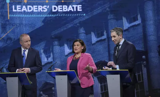 Tánaiste, Minister for Foreign Affairs, and Minister for Defence, Micheal Martin, from left, and Sinn Fein President Mary Lou McDonald and Taoiseach and Fine Gael leader Simon Harris speak during the final TV leaders' debate, at RTE studios in Donnybrook, Dublin, Tuesday, Nov. 26, 2024, ahead of the General Election on Nov. 29. (Niall Carson/PA via AP)