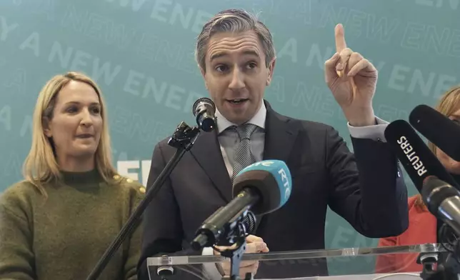 Taoiseach and Fine Gael leader Simon Harris and Helen McEntee, left, during a rally at Trim Castle Hotel in Trim, Co Meath, Ireland, Wednesday, Nov. 27, 2024. (Brian Lawless/PA via AP)