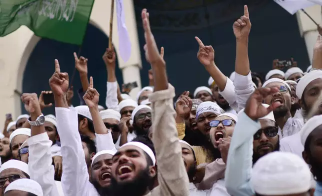 Hefazat-e-Islam supporters stage a protest after Friday prayers at Baitul Mukarram National Mosque, demanding an immediate ban on International Society for Krishna Consciousness (ISKCON) in Dhaka, Bangladesh, Friday, Nov. 29, 2024. (AP Photo/Mahmud Hossain Opu)