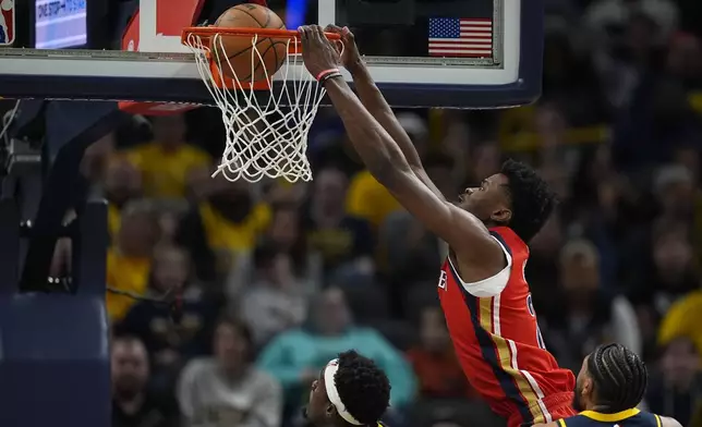 New Orleans Pelicans' Trey Murphy III dunks during the first half of an NBA basketball game against the Indiana Pacers, Monday, Nov. 25, 2024, in Indianapolis. (AP Photo/Darron Cummings)