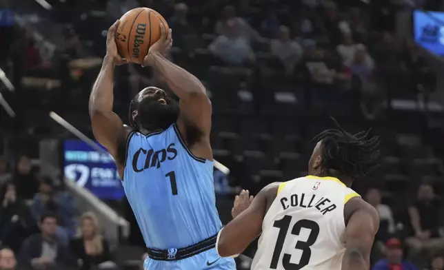 Los Angeles Clippers guard James Harden, left, shoots as Utah Jazz guard Isaiah Collier defends during the first half of an NBA basketball game, Sunday, Nov. 17, 2024, in Inglewood, Calif. (AP Photo/Mark J. Terrill)