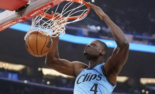 Los Angeles Clippers center Mo Bamba dunks during the first half of an NBA basketball game against the Utah Jazz, Sunday, Nov. 17, 2024, in Inglewood, Calif. (AP Photo/Mark J. Terrill)