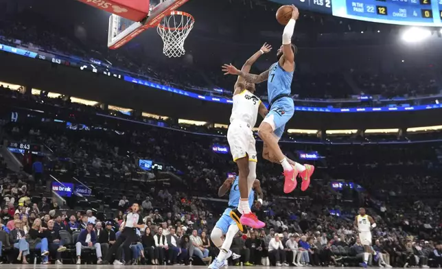 Los Angeles Clippers guard Amir Coffey, right, goes up for a dunk as Utah Jazz forward Cody Williams defends during the first half of an NBA basketball game, Sunday, Nov. 17, 2024, in Inglewood, Calif. (AP Photo/Mark J. Terrill)