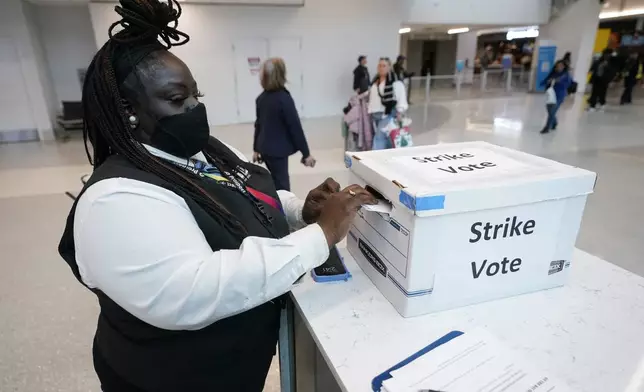 LaQuanda Harvey, a Prospect airport service worker, votes in favor of a strike at Charlotte Douglas International Airport, Friday, Nov. 22, 2024, in Charlotte, N.C. (AP Photo/Erik Verduzco)