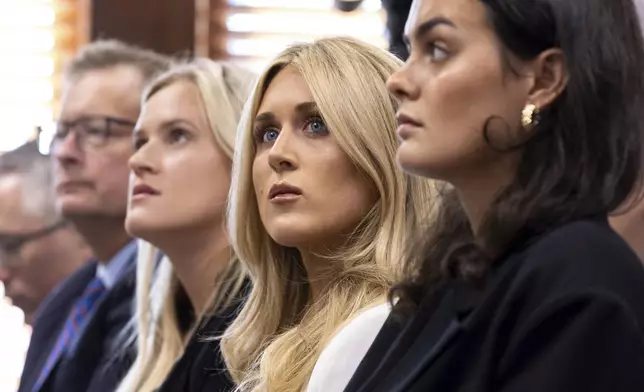 FILE - From third left, former collegiate swimmers Kaitlynn Wheeler, Riley Gaines, and Grace Countie prepare to testify in opposition to transgender athletes in women's sports in front of the state senate's Special Committee on Protecting Women's Sports at the Capitol in Atlanta, Tuesday, Aug. 27, 2024. (Arvin Temkar/Atlanta Journal-Constitution via AP, File)