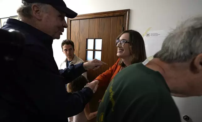 FILE - Sarah McBride, Democratic candidate for Delaware's at-large congressional district, greets people at the Immanuel Highlands Episcopal Church on Election Day, Tuesday, Nov. 5, 2024, in Wilmington, Del. She became the first openly transgender person elected to Congress. (AP Photo/Pamela Smith, File)