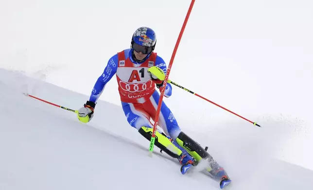 France's Clement Noel speeds down the course during an alpine ski, men's World Cup slalom, in Gurgl, Austria, Sunday, Nov. 24, 2024. (AP Photo/Giovanni Maria Pizzato)