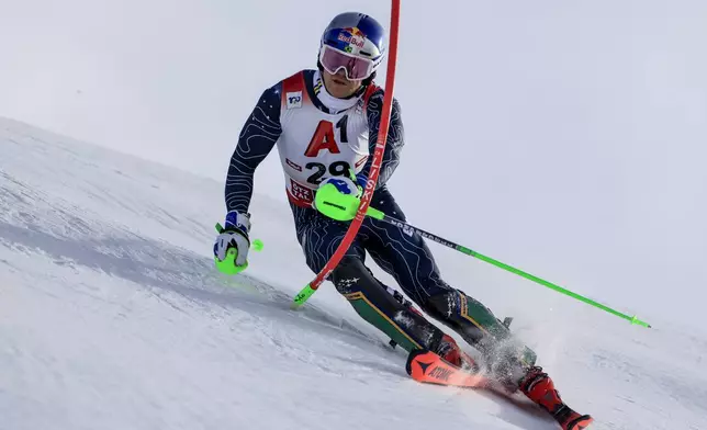 Brazil's Lucas Pinheiro Braathen speeds down the course during an alpine ski, men's World Cup slalom, in Gurgl, Austria, Sunday, Nov. 24, 2024. (AP Photo/Giovanni Maria Pizzato)