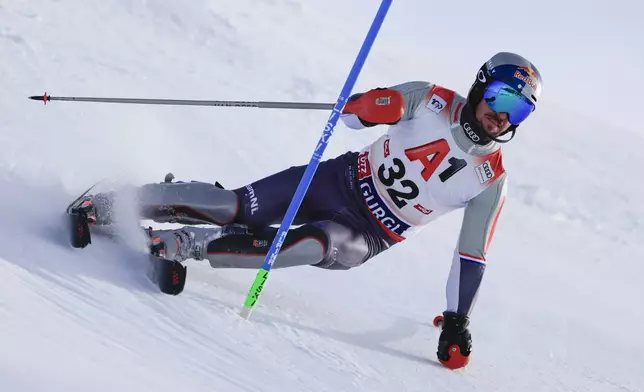 Netherland's Marcel Hirscher speeds down the course during an alpine ski, men's World Cup slalom, in Gurgl, Austria, Sunday, Nov. 24, 2024. (AP Photo/Giovanni Maria Pizzato)