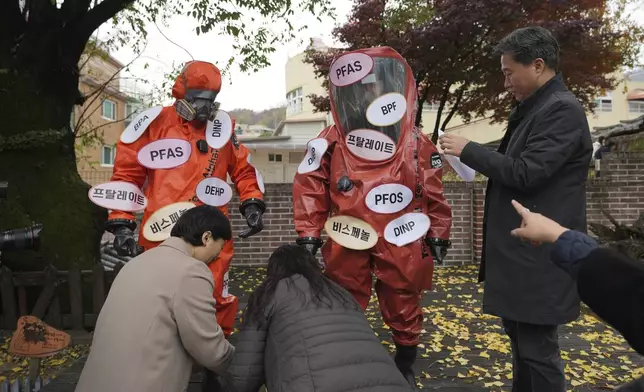 Environment activists prepare for a rally calling for a strong global plastics treaty ahead of the fifth session of the Intergovernmental Negotiating Committee on Plastic Pollution which sets to be held in Busan from Nov. 25 to Dec. 1, in Seoul, South Korea, Wednesday, Nov. 20, 2024. (AP Photo/Lee Jin-man)