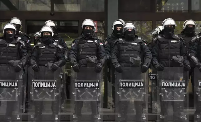 Serbian police officers guard a courthouse during anti-government protest demanding arrests over a deadly roof collapse at a railway station in Novi Sad, Serbia, Wednesday, Nov. 20, 2024. (AP Photo)