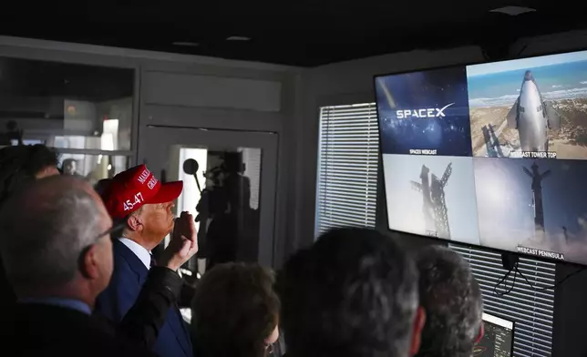 President-elect Donald Trump listens as Elon Musk explains the operations ahead of the launch of the sixth test flight of the SpaceX Starship rocket Tuesday, Nov. 19, 2024 in Boca Chica, Texas. (Brandon Bell/Pool via AP)