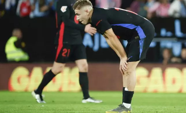 Barcelona's Fermin Lopez reacts at the end of the Spanish La Liga soccer match between Celta Vigo and Barcelona at the Balaidos stadium in Vigo, Spain, Saturday, Nov. 23, 2024. (AP Photo/Lalo R. Villar)