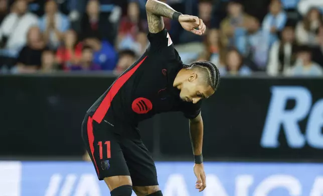 Barcelona's Raphinha reacts after the Spanish La Liga soccer match between Celta Vigo and Barcelona at the Balaidos stadium in Vigo, Spain, Saturday, Nov. 23, 2024. (AP Photo/Lalo R. Villar)