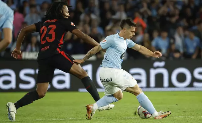 Celta's Alfon, right, is challenged by Barcelona's Jules Kounde during the Spanish La Liga soccer match between Celta Vigo and Barcelona at the Balaidos stadium in Vigo, Spain, Saturday, Nov. 23, 2024. (AP Photo/Lalo R. Villar)