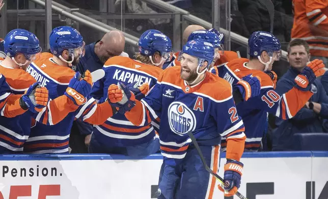 Edmonton Oilers' Leon Draisaitl (29) celebrates after a goal against the Minnesota Wild during first-period NHL hockey game action in Edmonton, Alberta, Thursday, Nov. 21, 2024. (Jason Franson/The Canadian Press via AP)