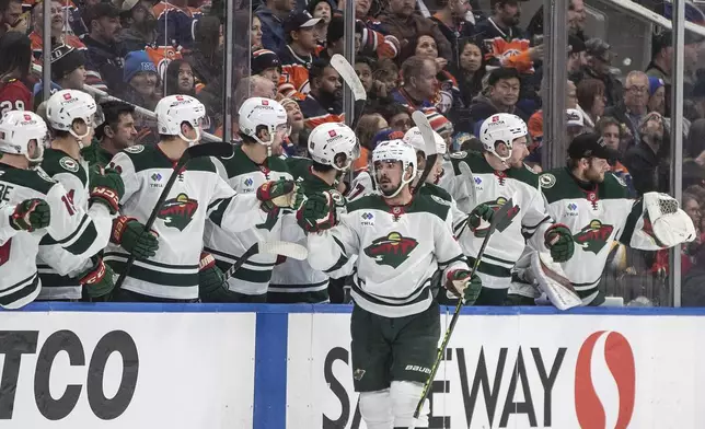 Minnesota Wild's Marcus Johansson (90) celebrates a goal with teammates against the Edmonton Oilers during second period NHL action in Edmonton on Thursday, November 21, 2024. (Jason Franson/The Canadian Press via AP)