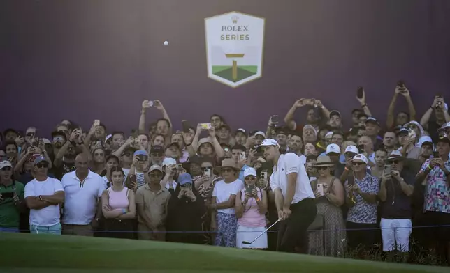 Rasmus Hojgaard of Denmark plays a shot on the 18th green in the final round of World Tour Golf Championship, in Dubai, United Arab Emirates, Sunday, Nov. 17, 2024. (AP Photo/Altaf Qadri)