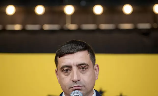 George Simion, the Alliance for the Unity of Romanians (AUR) candidate for president speaks during a press briefing before the polls close during the country's presidential elections, in Bucharest, Romania, Sunday, Nov. 24, 2024. (AP Photo/Andreea Alexandru)