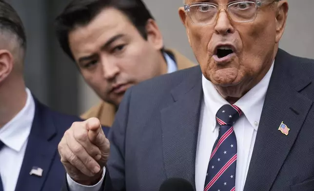 Rudy Giuliani speaks to reporters as he leaves the federal courthouse in New York, Tuesday, Nov. 26, 2024. (AP Photo/Seth Wenig)