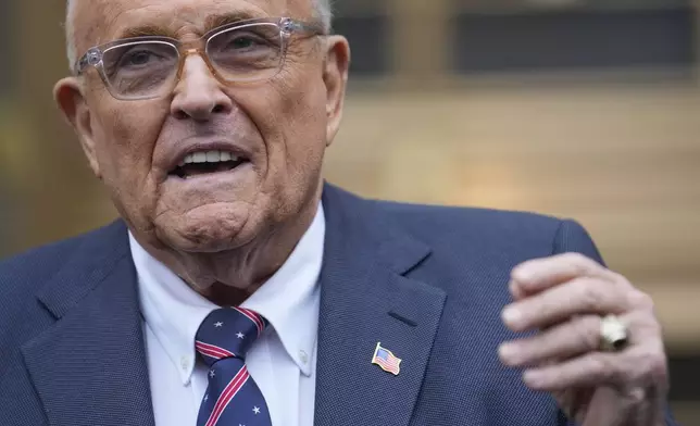 Rudy Giuliani speaks to reporters as he leaves the federal courthouse in New York, Tuesday, Nov. 26, 2024. (AP Photo/Seth Wenig)