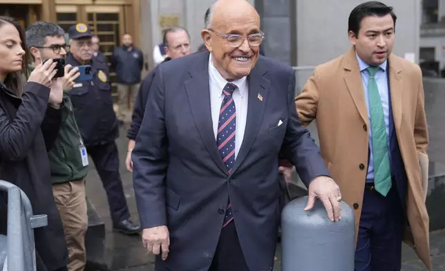 Rudy Giuliani speaks to reporters as he leaves the federal courthouse in New York, Tuesday, Nov. 26, 2024. (AP Photo/Seth Wenig)