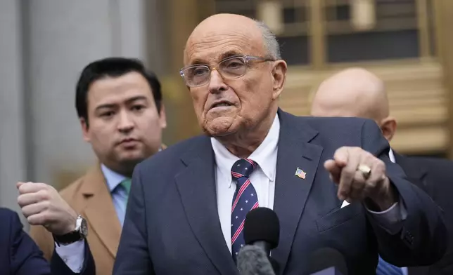 Rudy Giuliani speaks to reporters as he leaves the federal courthouse in New York, Tuesday, Nov. 26, 2024. (AP Photo/Seth Wenig)