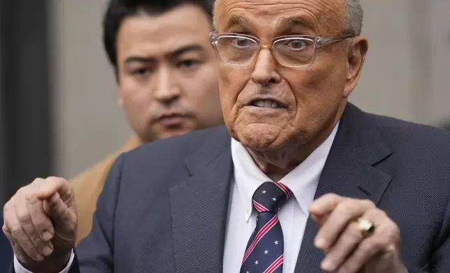 Rudy Giuliani speaks to reporters as he leaves the federal courthouse in New York, Tuesday, Nov. 26, 2024. (AP Photo/Seth Wenig)