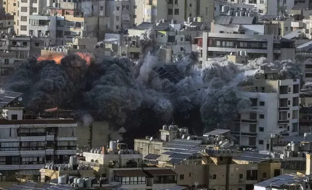 Flame and smoke rise after an Israeli airstrike on Dahiyeh, in the southern suburb of Beirut, Lebanon, Saturday, Nov. 16, 2024. (AP Photo/Bilal Hussein)