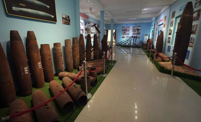 Bomb casings recovered from the war are displayed at the Peace Museum Mine Action in Siem Reap province of northwestern Cambodia, Friday, Jan. 20, 2023. (AP Photo/Heng Sinith)