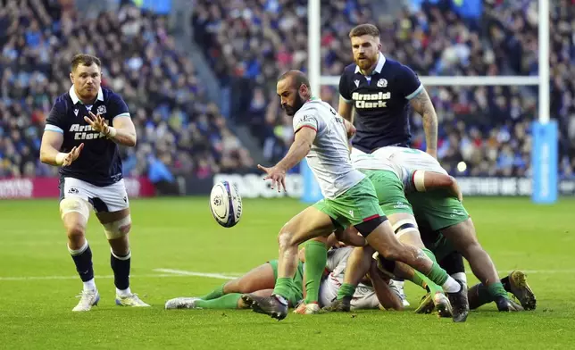 Portugal's Samuel Marques clears the ball during the Autumn Nations series rugby union match between Scotland and Portugal at the Scottish Gas Murrayfield Stadium, in Edinburgh, Scotland, Saturday Nov. 16, 2024. (Jane Barlow/PA via AP)