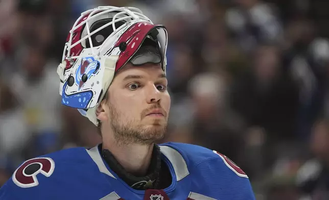 Colorado Avalanche goaltender Alexandar Georgiev skates around the net during a time out in the second period of an NHL hockey game against the Los Angeles Kings Wednesday, Nov. 13, 2024, in Denver. (AP Photo/David Zalubowski)