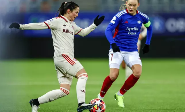 Valerenga's Janni Thomsen, right, and Munich's Tuva Hansen, left, challenge for the ball during the Women's Champions League, group C, soccer match between Valerenga and FC Bayern Munich in Oslo, Norway, Thursday, Nov. 21, 2024. (Jonas Been Henriksen/NTB Scanpix via AP)