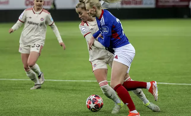 Valerenga's Karina Sævik, right, and Munich's Giulia Gwinn, left, challenge for the ball during the Women's Champions League, group C, soccer match between Valerenga and FC Bayern Munich in Oslo, Norway, Thursday, Nov. 21, 2024. (Jonas Been Henriksen/NTB Scanpix via AP)