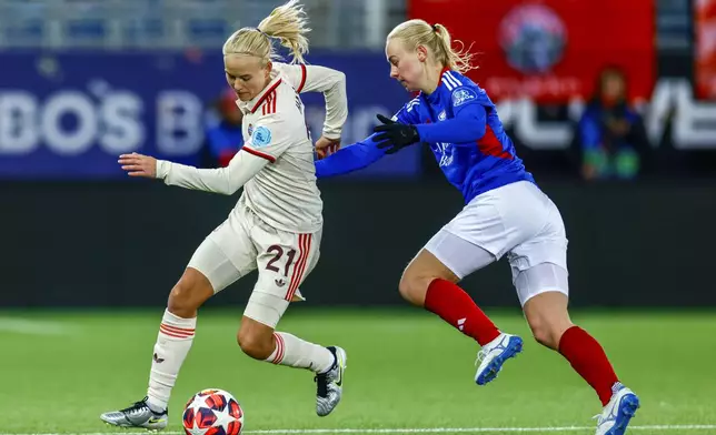 Valerenga's Sara Heard, right, and Munich's Pernille Harder, left, challenge for the ball during the Women's Champions League, group C, soccer match between Valerenga and FC Bayern Munich in Oslo, Norway, Thursday, Nov. 21, 2024. (Jonas Been Henriksen/NTB Scanpix via AP)