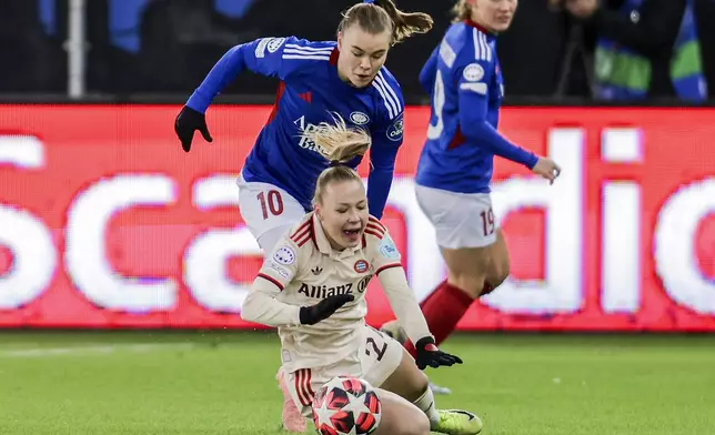 Valerenga's Olaug Tvedten, left, and Munich's Pernille Harder, front, challenge for the ball during the Women's Champions League, group C, soccer match between Valerenga and FC Bayern Munich in Oslo, Norway, Thursday, Nov. 21, 2024. (Jonas Been Henriksen/NTB Scanpix via AP)