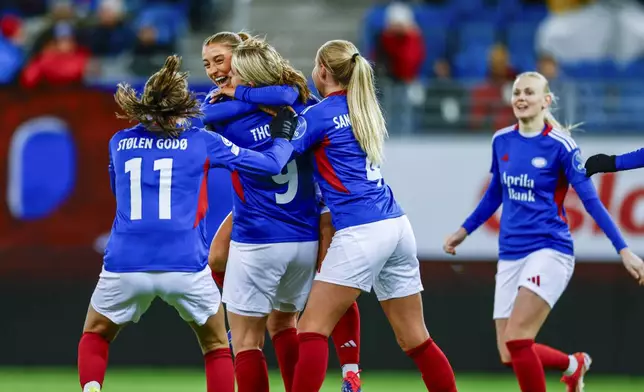 Valerenga's players cheer after Elise Thorsnes, third left, scored her side's first goal during the Women's Champions League, group C, soccer match between Valerenga and FC Bayern Munich in Oslo, Norway, Thursday, Nov. 21, 2024. (Jonas Been Henriksen/NTB Scanpix via AP)