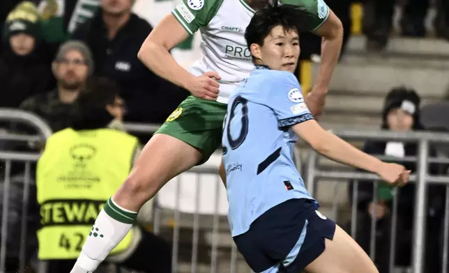 Hammarby's Julie Blakstad and Manchester's Aoba Fujino, front, in action during the women's Champions League soccer match between Hammarby IF and Manchester City at Tele2 Arena, Stockholm, Sweden, Thursday Nov. 21, 2024. (Claudio Bresciani/TT via AP)