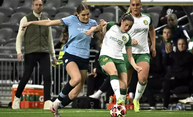 Manchester City's Gracie Prior, left, and Hammarby's Smilla Vallotto in action during the women's Champions League soccer match between Hammarby IF and Manchester City at Tele2 Arena, Stockholm, Sweden, Thursday Nov. 21, 2024. (Claudio Bresciani/TT via AP)