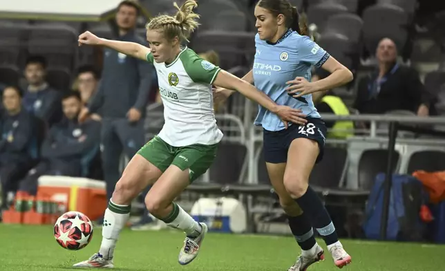 Hammarby's Julie Blakstad, left, and Manchester City's Gracie Prior in action during the women's Champions League soccer match between Hammarby IF and Manchester City at Tele2 Arena, Stockholm, Sweden, Thursday Nov. 21, 2024. (Claudio Bresciani/TT via AP)