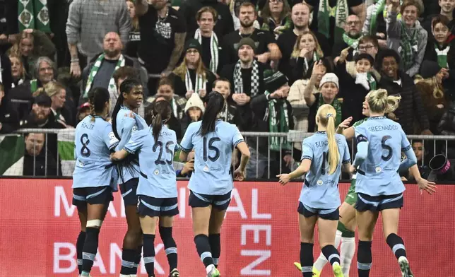 Manchester City's Manchester Khadija Shaw, second left, celebrates scoring during the women's Champions League soccer match between Hammarby IF and Manchester City at Tele2 Arena, Stockholm, Sweden, Thursday Nov. 21, 2024. (Claudio Bresciani/TT via AP)