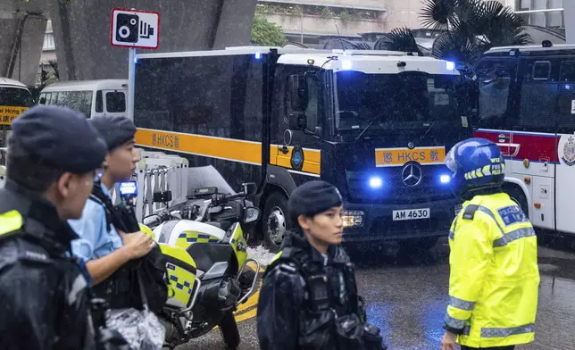 A Correctional Services Department vehicle arrives at the West Kowloon Magistrates' Courts in Hong Kong, Wednesday, Nov. 20, 2024, ahead of Hong Kong activist publisher Jimmy Lai's national security trial. (AP Photo/Chan Long Hei)