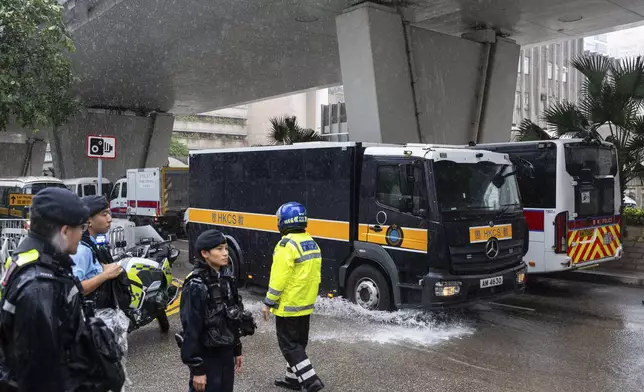 A Correctional Services Department vehicle arrives at the West Kowloon Magistrates' Courts in Hong Kong, Wednesday, Nov. 20, 2024, ahead of Hong Kong activist publisher Jimmy Lai's national security trial. (AP Photo/Chan Long Hei)