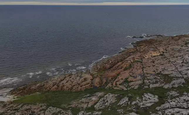 Waves from Hudson Bay crash onto shore, Wednesday, Aug. 7, 2024, in Churchill, Manitoba. (AP Photo/Joshua A. Bickel)