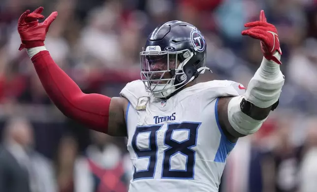 Tennessee Titans defensive tackle Jeffery Simmons (98) celebrates the team's win against the Houston Texans after an NFL football game Sunday, Nov. 24, 2024, in Houston. (AP Photo/Eric Christian Smith)