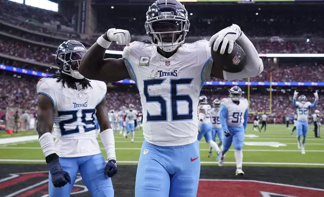 Tennessee Titans linebacker Kenneth Murray Jr. (56) celebrates an interception during the second half an NFL football game against the Houston Texans, Sunday, Nov. 24, 2024, in Houston. (AP Photo/Eric Christian Smith)