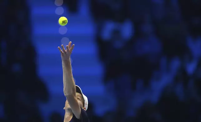 Italy's Jannik Sinner serves the ball to Russia's Daniil Medvedev during their singles tennis match of the ATP World Tour Finals at the Inalpi Arena, in Turin, Italy, Thursday, Nov. 14, 2024. (AP Photo/Antonio Calanni)