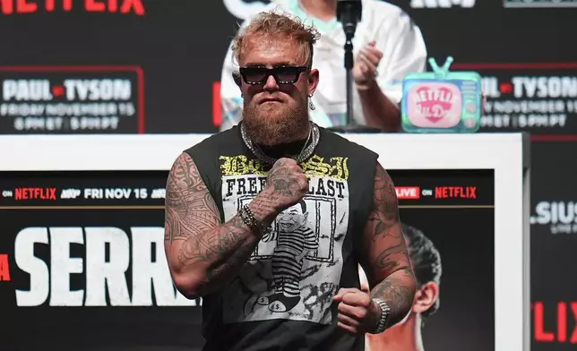 Jake Paul reacts during a news conference ahead of his fight against Mike Tyson, Wednesday, Nov. 13, 2024, in Irving, Texas. (AP Photo/Julio Cortez)