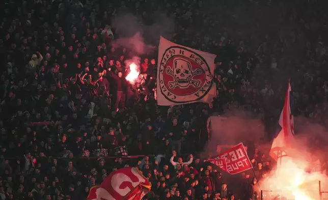 Supporters of Red Star celebrate after Mirko Ivanic scored his side's third goal during the Champions League opening phase soccer match between Red Star and Stuttgart at the Rajko Mitic Stadium in Belgrade, Serbia, Wednesday, Nov. 27, 2024. (AP Photo/Darko Vojinovic)